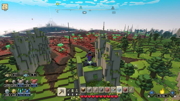 Examen de Minecraft Legends - capture d'écran de Minecraft Legends, un angle de caméra élevé de certaines structures en pierre dans des collines verdoyantes
