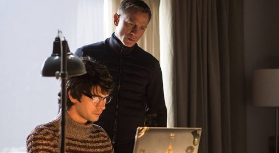 Ben Whishaw and Daniel Craig looking at a laptop together in Spectre.