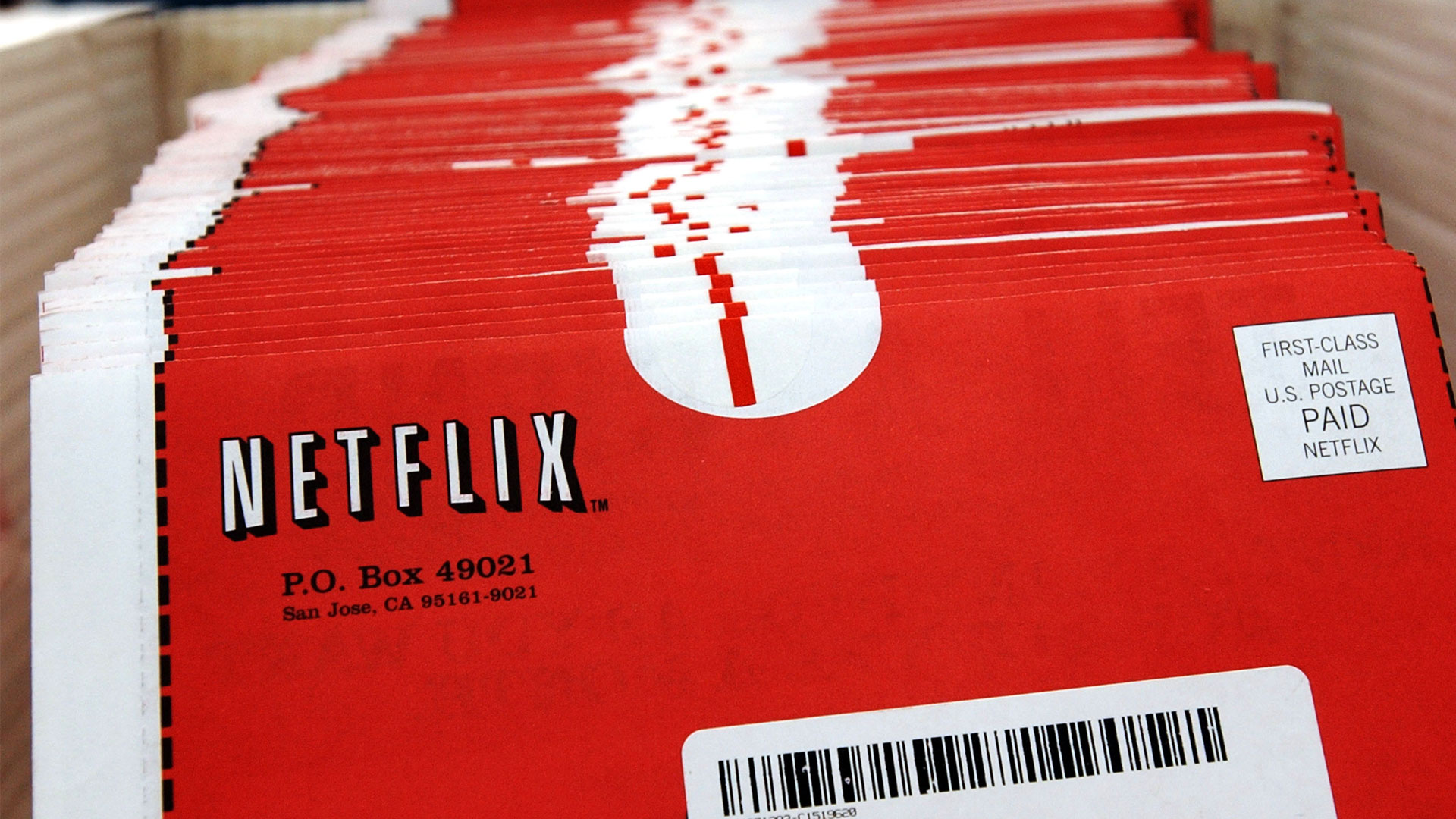 Une capture d'écran de plusieurs enveloppes rouges de DVD Netflix empilées