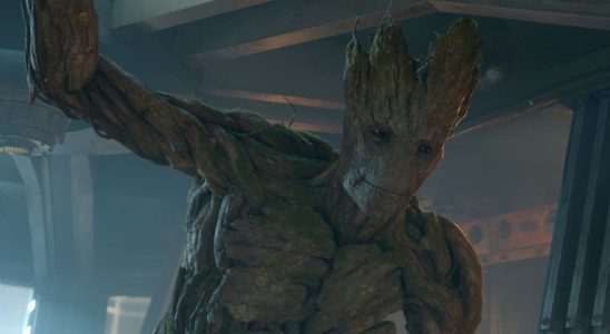 Groot stands smiling in a ship