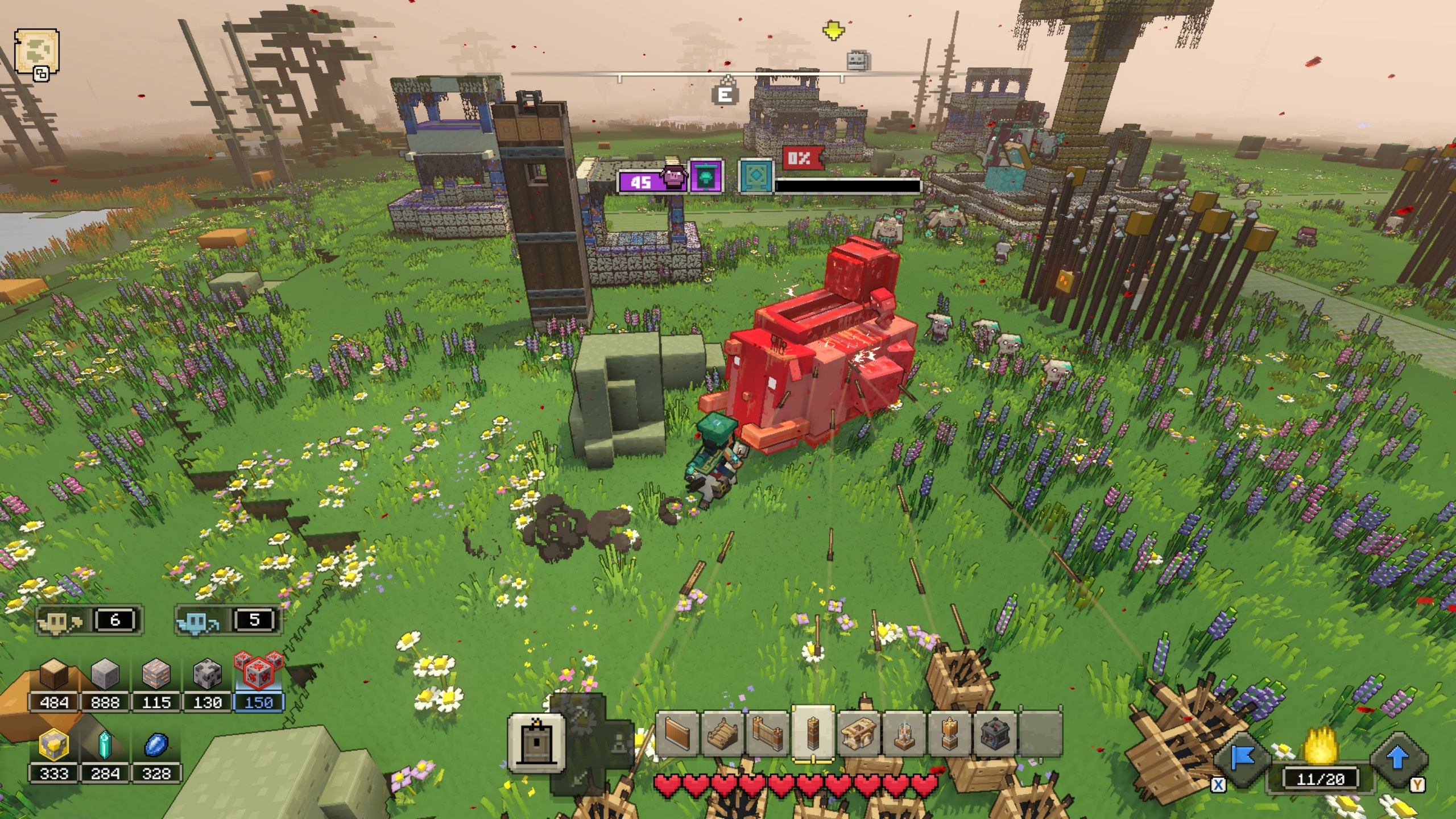 Minecraft Legends - un joueur et ses golems de planches attaquent un éléphant lanceur laval pour défendre un village