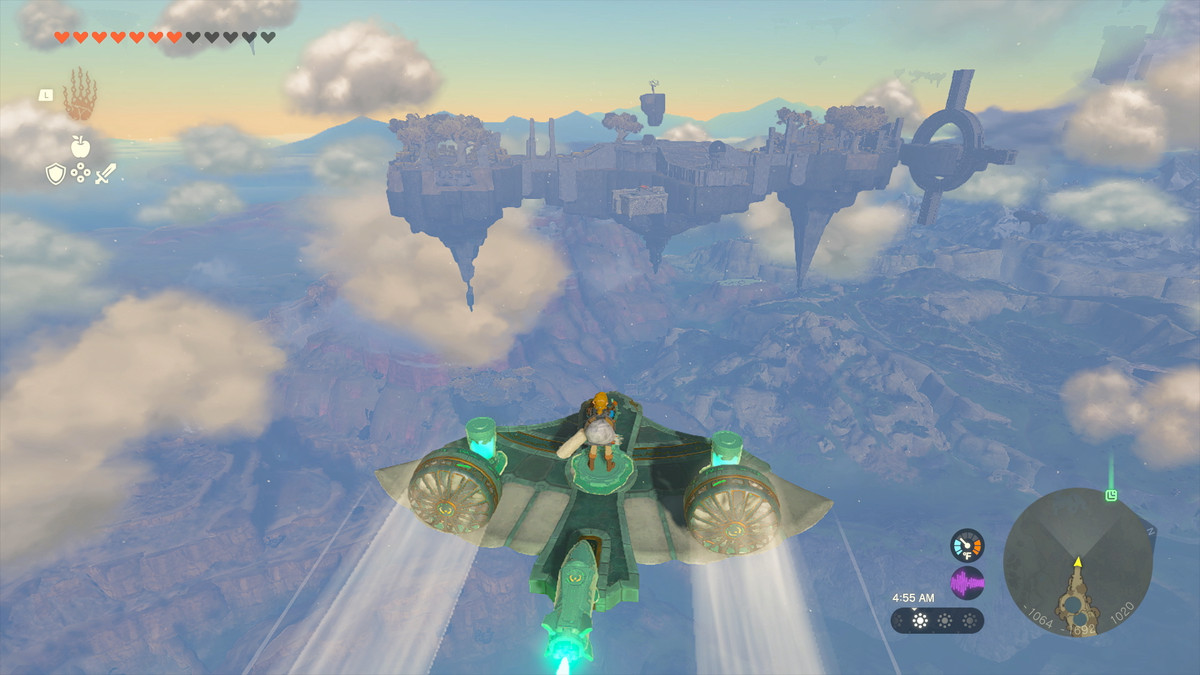 Link monte un planeur / avion de fortune, alimenté par des batteries Zonai, vers une île au loin dans The Legend of Zelda: Tears of the Kingdom