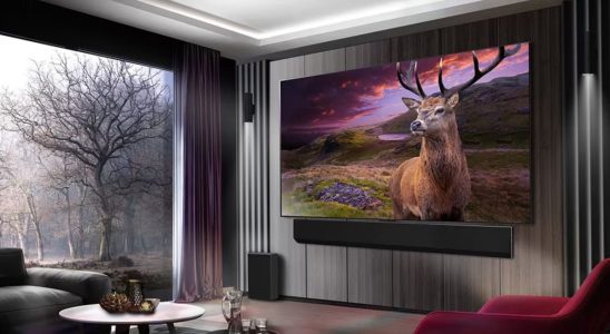 LG OLED G3 marketing image of the TV mounted on a wall in a living room displaying a Deer in a dramatic nature scene.