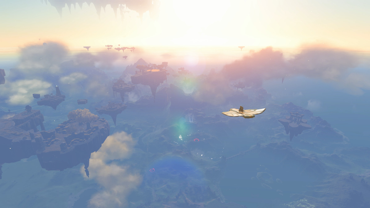 Link est une petite silhouette planant dans le ciel sur un appareil volant en forme d'aile.  Ci-dessous, un paysage brumeux se fondant dans un coucher de soleil