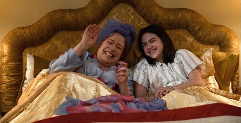 Kathy Bates and Abby Ryder Fortson laughing in bed together in "Are You There God? It's Me Margaret"