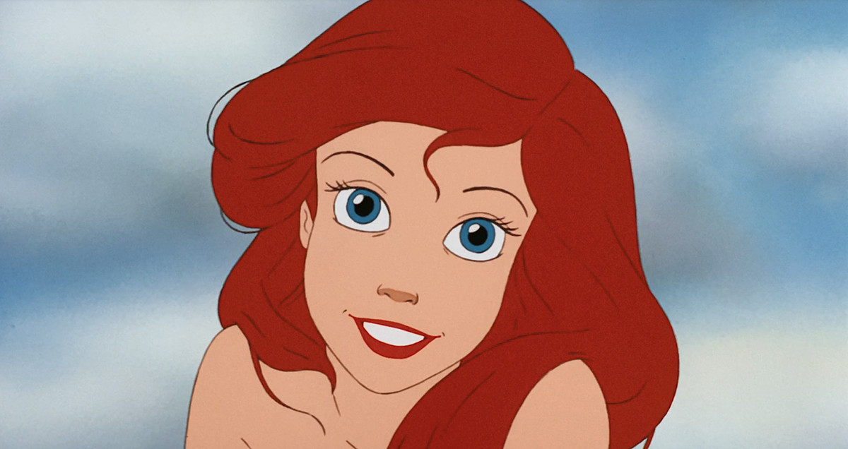 Ariel sourit directement à la caméra dans un gros plan de la Petite Sirène animée de 1989
