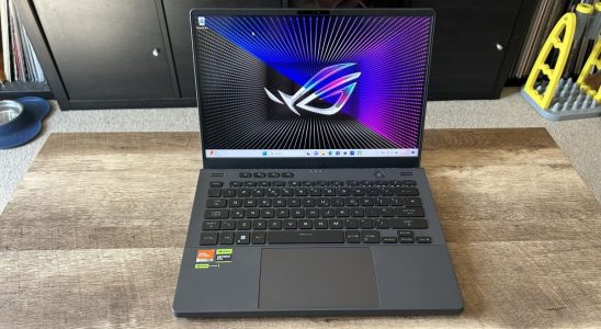 Asus ROG Zephyrus G14 gaming laptop on wooden table