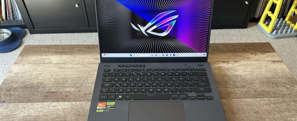 Asus ROG Zephyrus G14 gaming laptop on wooden table