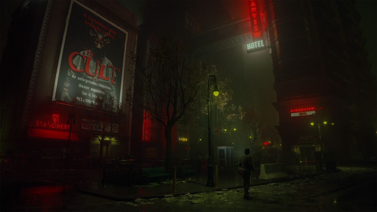 Alan Wake marchant dans une ville sombre entourée de panneaux d'affichage d'un film d'horreur intitulé 