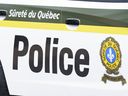  Une voiture de police provinciale est vue à Montréal le 22 juillet 2020. LA PRESSE CANADIENNE/Paul Chiasson
