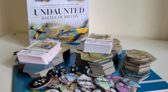 Undaunted: Battle of Britain box, board, and token pieces on a white table