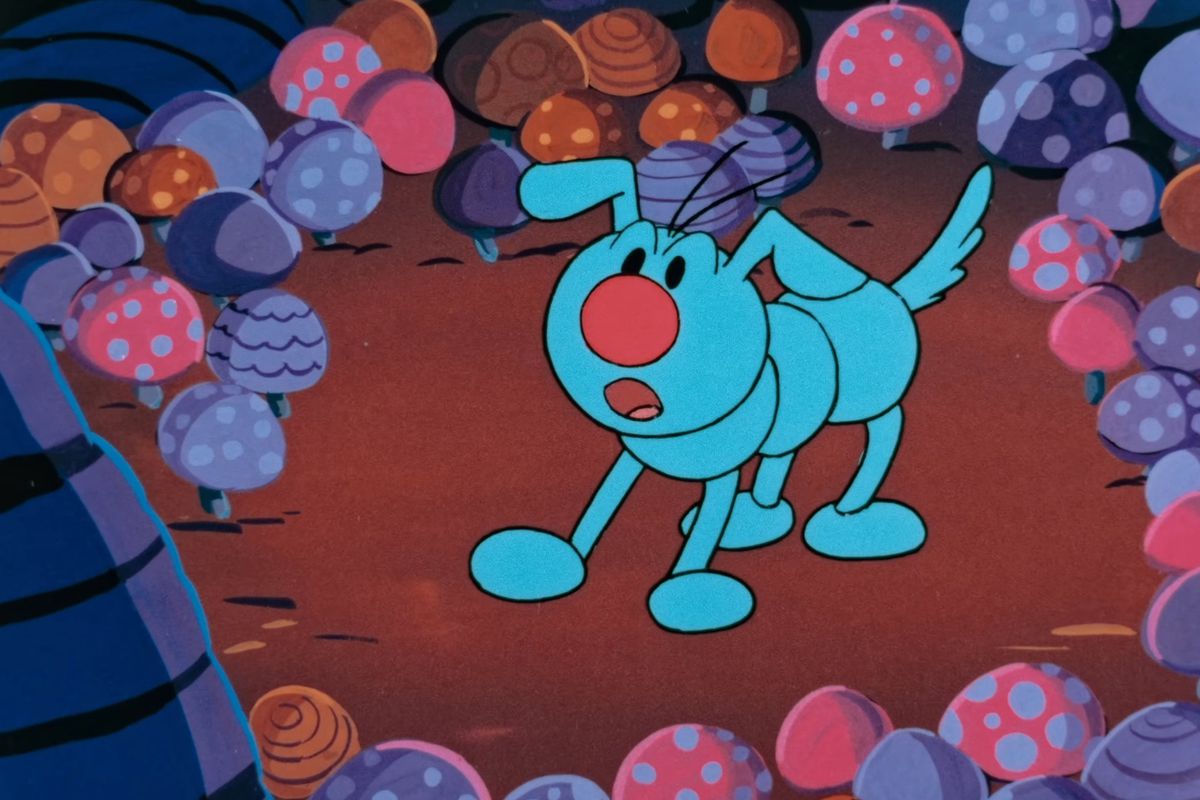 Kibidango (alias Dumpling Dog) se tient dans un champ de champignons dans une image de Super Mario Bros. - The Great Mission to Rescue Princess Peach