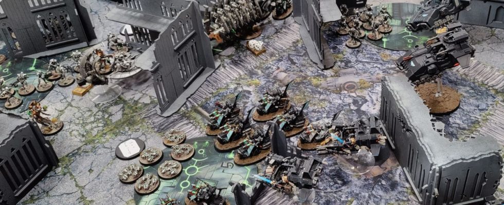 Warhammer 40,000 10th Edition being played on a ruined battlefield, with Space Marines taking on Necrons