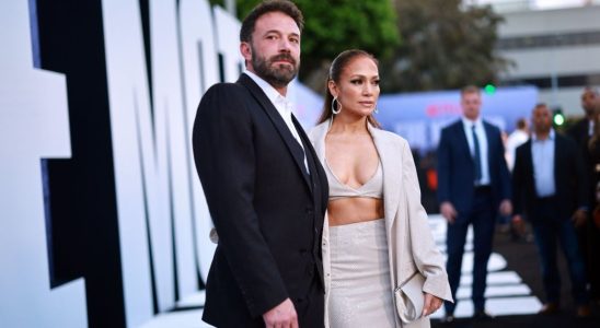 Ben Affleck and Jennifer Lopez posing together on the red carpet of The Mother premiere.