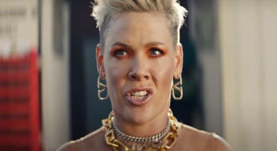 Pink with earrings and necklaces in music video for Never Gonna Not Dance Again