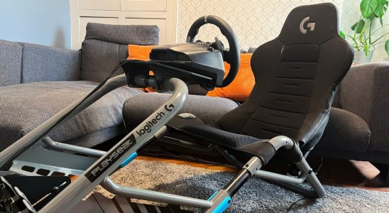 Playseat Trophy Logitech G Edition hero image assembled in a living room sitting in front of a reviewer