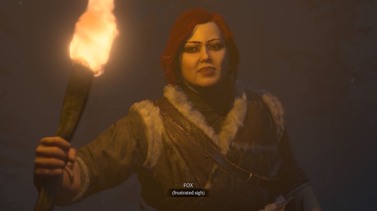 Le druide roux de l'écrivain, brandissant une torche dans le désert sombre de Diablo 4. Il s'agit d'une cinématique agrandie sur le visage frustré du personnage à la lueur des torches.  Le texte du dialogue au bas de l'image indique 