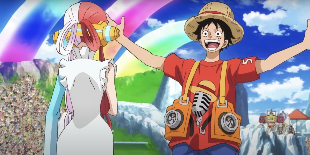 Le pirate Luffy, au chapeau de paille, au centre de la franchise d'anime et de manga One Piece, accueille son vieil ami Uta à bras ouverts et avec une bouche immense dans One Piece Film : Rouge.