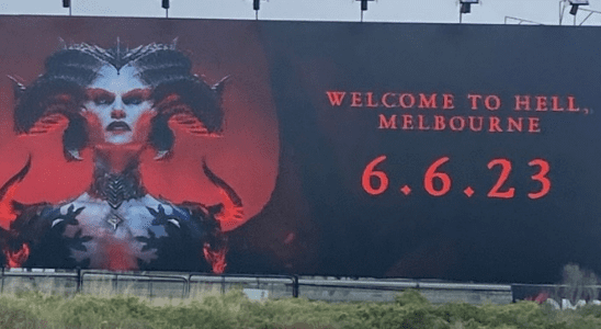 A billboard of Lilith, a horned devilish antagonist from Diablo 4, looming at the viewer, with the words: