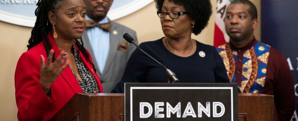 (From left) Senator Lola Smallwood-Cuevas is flanked by Assemblymembers Mike Gipson, Tina McKinnor and Corey Jackson as she addresses the removal of Black female DEI studio executives during the California Legislative Black Caucus press conference.
