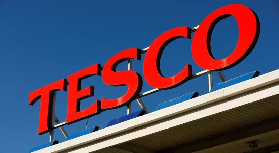 Tesco logo with a clear, blue sky behind it.