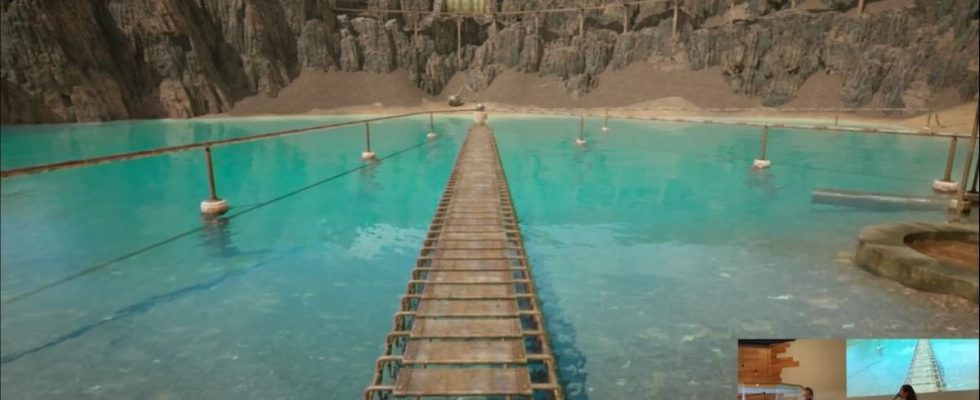on-stream view of gameplay from the remake of Riven: The Sequel to Myst, showing a boiler on the shore of a crater lake with scaffolding going out into the middle of the lake