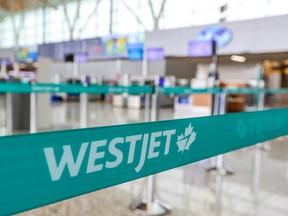 Une zone d'enregistrement WestJet à l'aéroport international de Calgary.