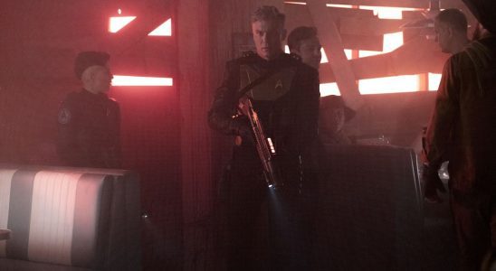 Captain Pike wielding laser rifle on Star Trek: Strange New Worlds