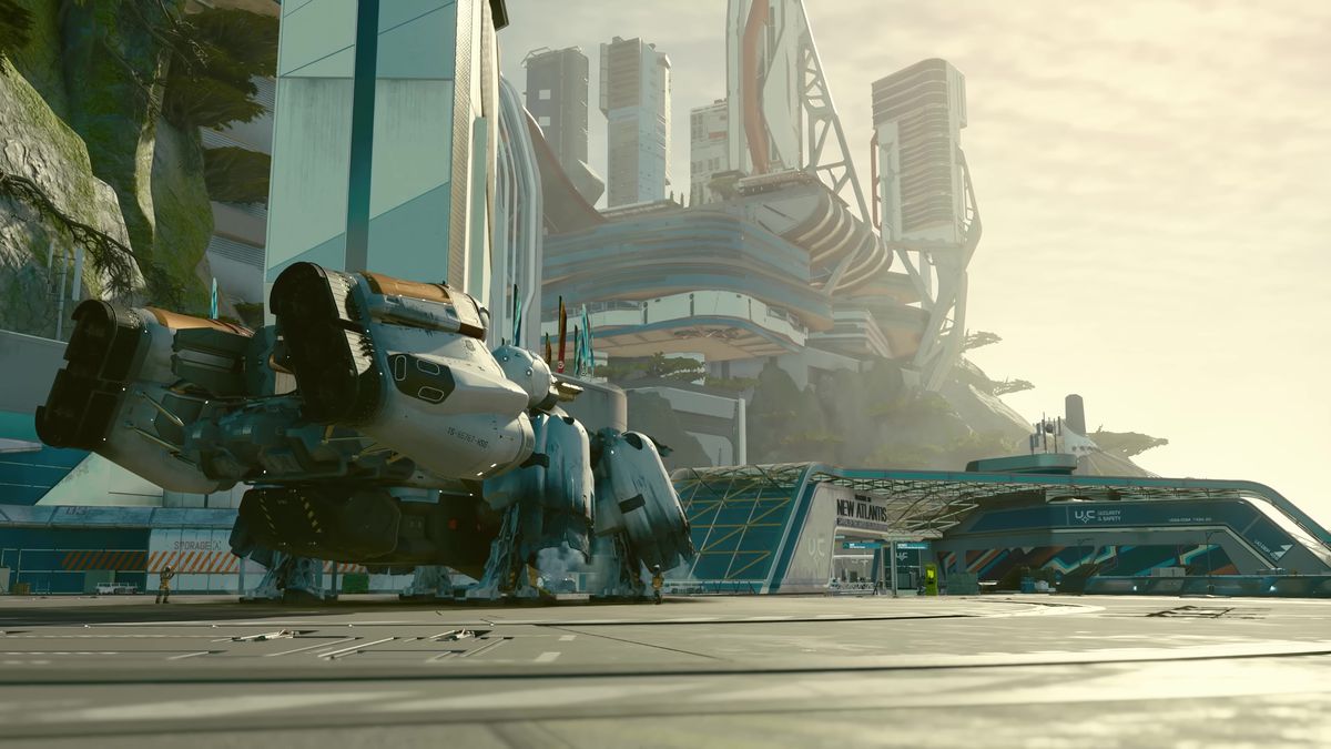 dans une capture d'écran de Starfield, un vaisseau spatial est garé sur une zone d'atterrissage dans une ville futuriste appelée New Atlantis