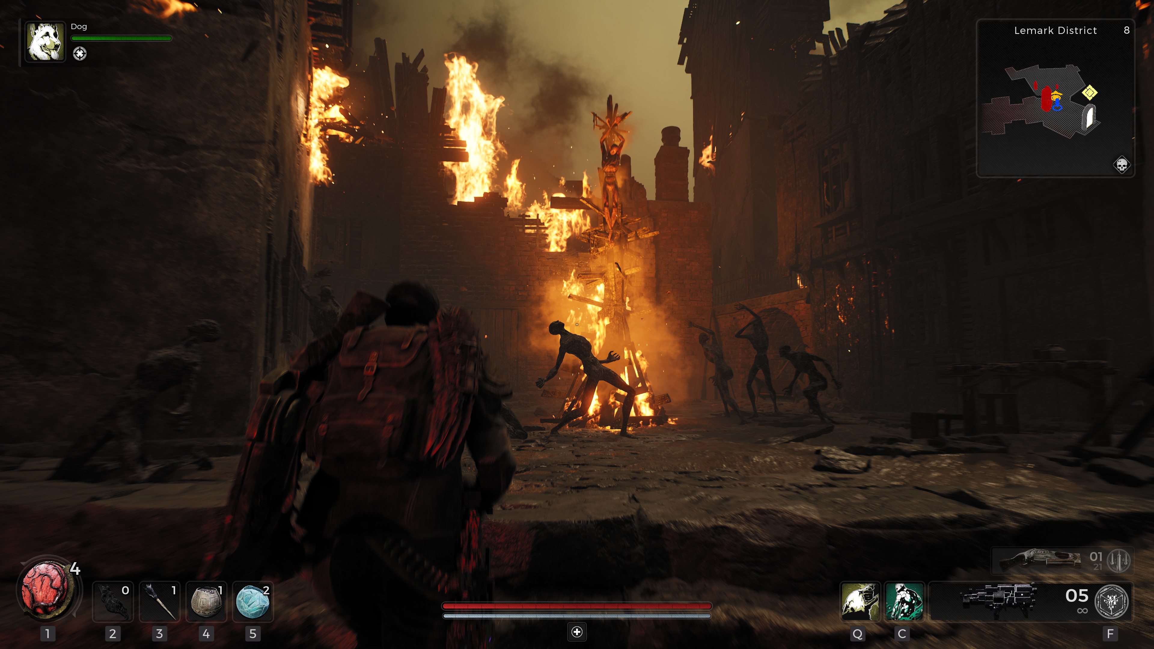 Le joueur entrant dans une ville en ruine et en flammes dans Remnant 2.