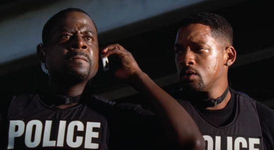 Martin Lawrence takes an upsetting phone call while Will Smith watches in Bad Boys II.