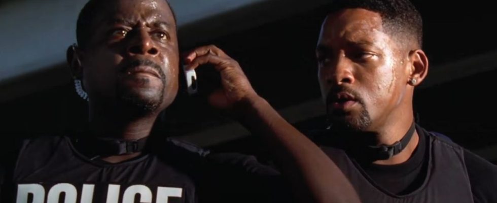 Martin Lawrence takes an upsetting phone call while Will Smith watches in Bad Boys II.