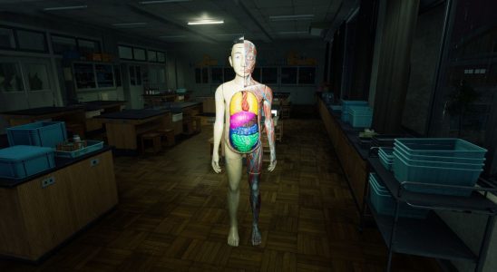 An anatomy mannequin in a darkened schoolroom
