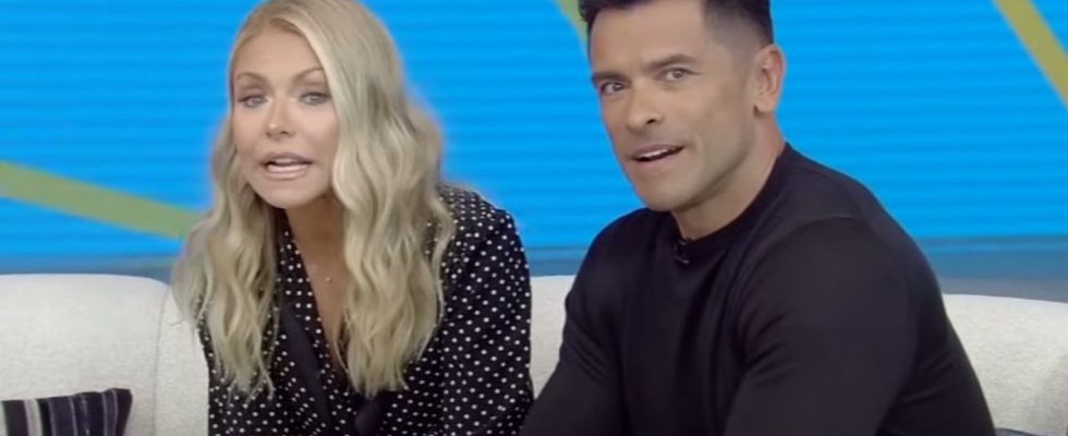 Kelly Ripa and Mark Consuelos on couch hosting Live with Kelly and Mark