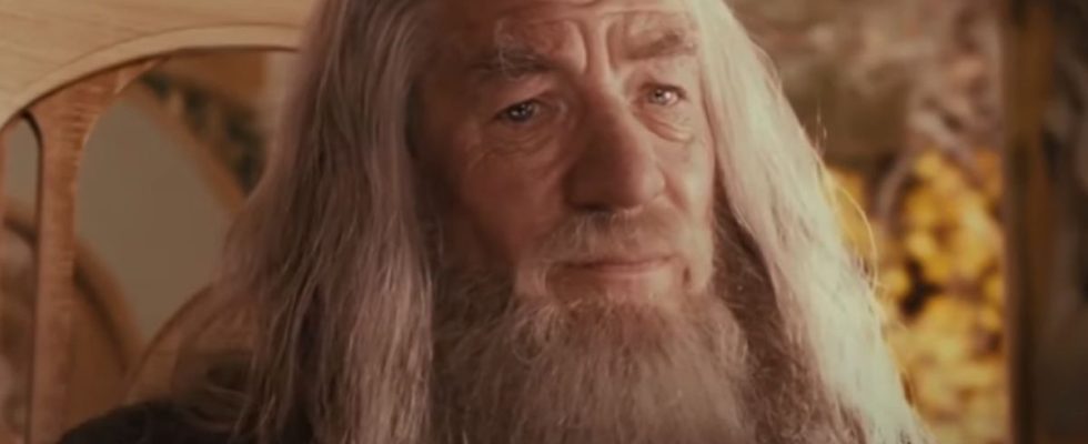 Ian McKellen sits in Rivendell with a concerned look on his face in The Lord of the Rings: The Fellowship of the Ring.
