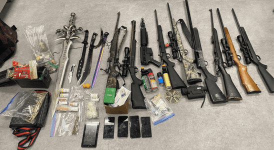 The result of a raid by the Norway House RCMP, detailing several firearms, bags of what may be drugs, and Frostmourne from World of Warcraft.