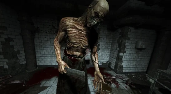 Outlast: An emaciated Dr. Trager holding a cleaver.
