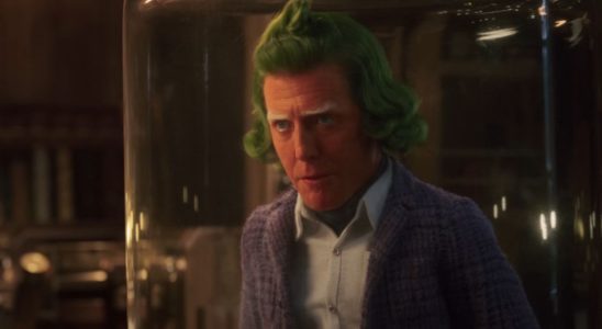Hugh Grant talking while trapped under glass in Wonka.