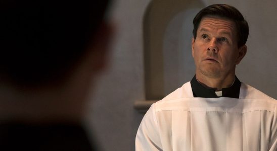 Mark Wahlberg dressed in his priests robes in Father Stu.