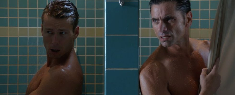 Glen Powell and John Stamos talking in the shower in Scream Queens.