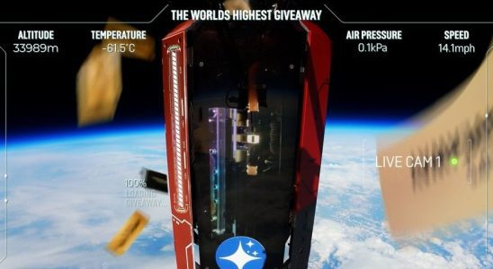 A gaming PC hovers in space, surrounded by falling golden tickets.