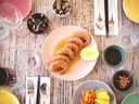 Crevettes à l'ail à Hānai.  Le restaurant hawaïen est l'un des 10 endroits de Vancouver récemment recommandés par le Guide Michelin.