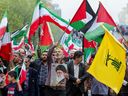 Des Iraniens participent à un rassemblement anti-israélien pour montrer leur solidarité avec les Palestiniens dans la capitale Téhéran, le 13 octobre 2023. Des milliers d'Iraniens sont descendus dans les rues de Téhéran vendredi pour manifester leur soutien au Hamas. 