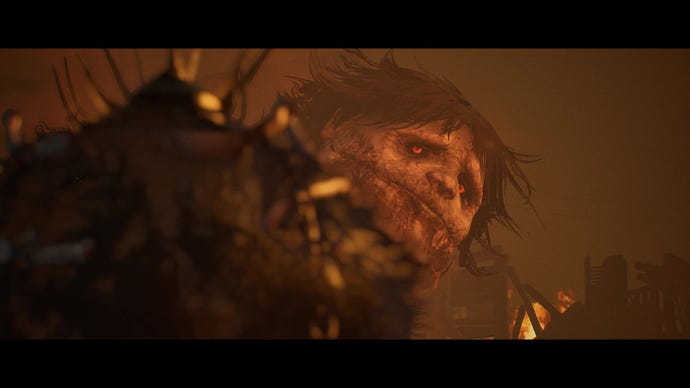 Une capture d'écran de Lords Of The Fallen qui montre un visage énorme, presque enfantin, tourné vers le joueur.