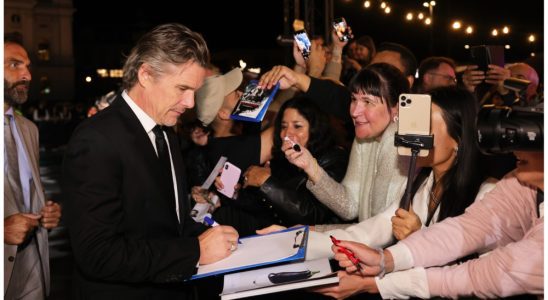 Ethan Hawke signs autographs as he attends the premiere of "Wildcat" during the 19th Zurich Film Festival at Kino Corso on September 30, 2023.
