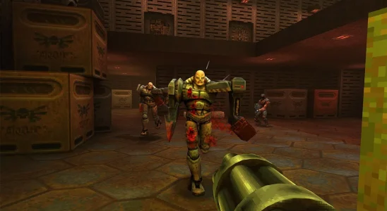 Quake 2: the player about to fire at some Stroggs in a warehouse.
