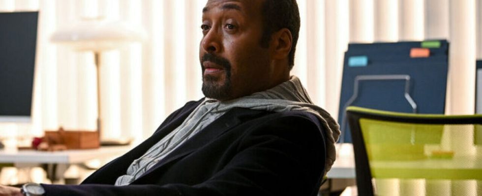 Jesse L. Martin sitting at desk as Alec in The Irrational