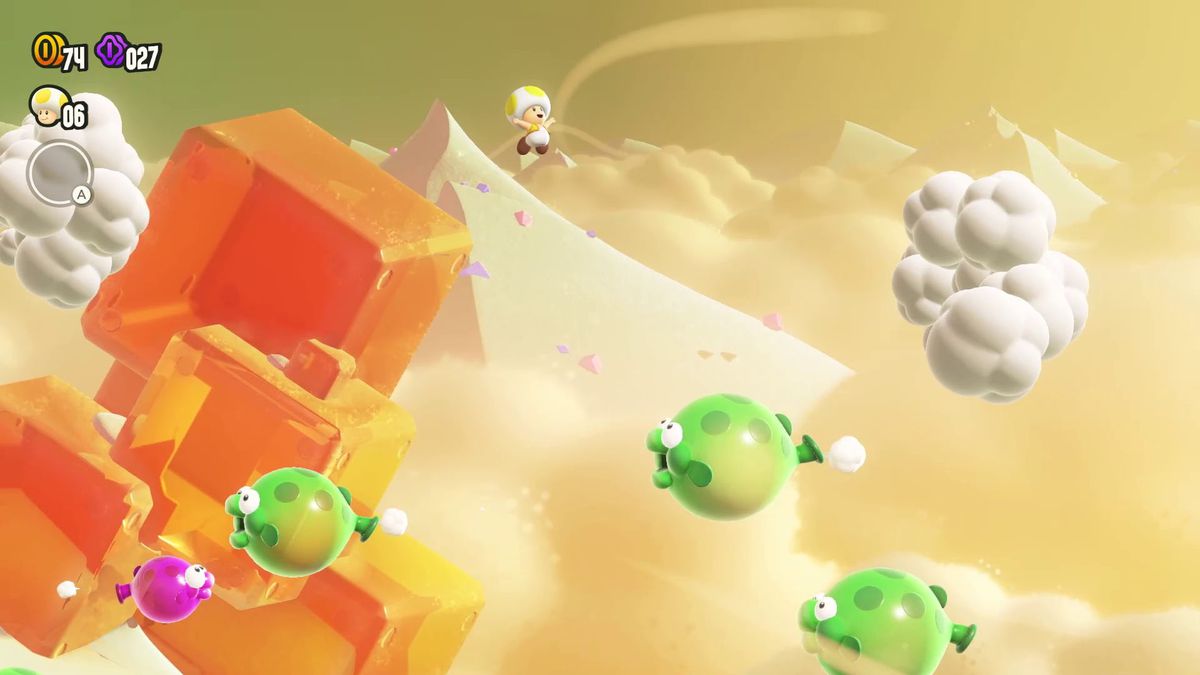 Yellow Toad saute dans les airs au-dessus d'une meute de Bloomp, des poissons volants en forme de ballon, dans une capture d'écran de Super Mario Bros. Wonder