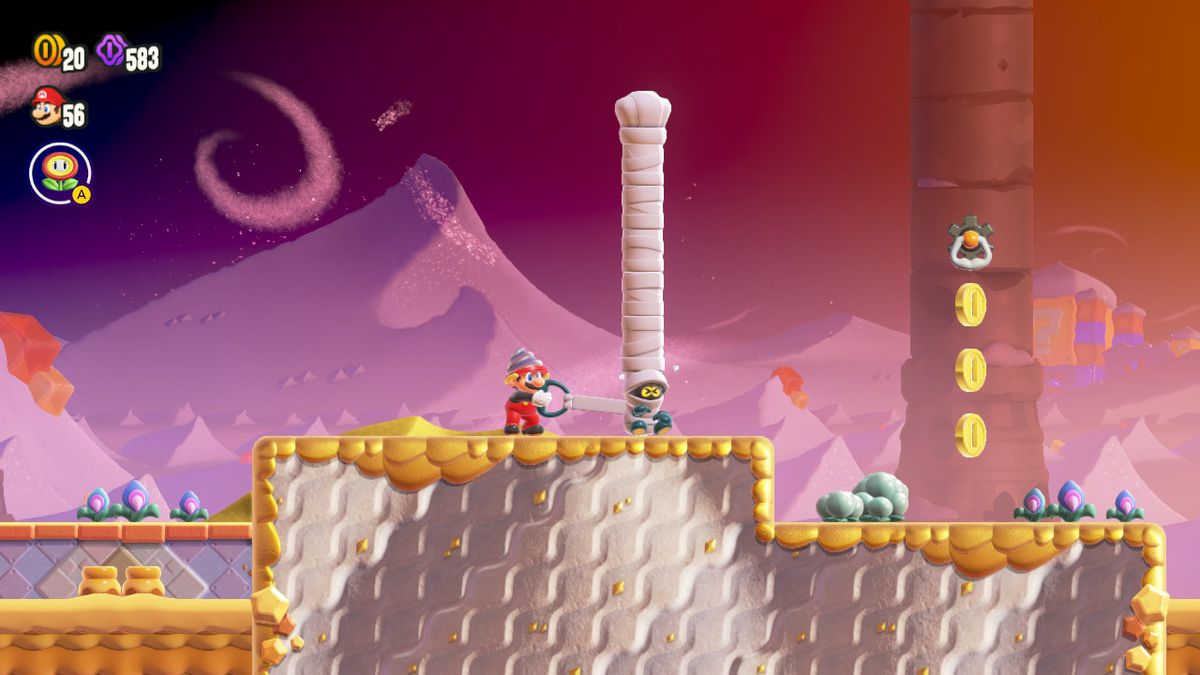 Mario tire sur l'emballage d'une Mumsie pour le démêler dans une capture d'écran de Super Mario Bros. Wonder