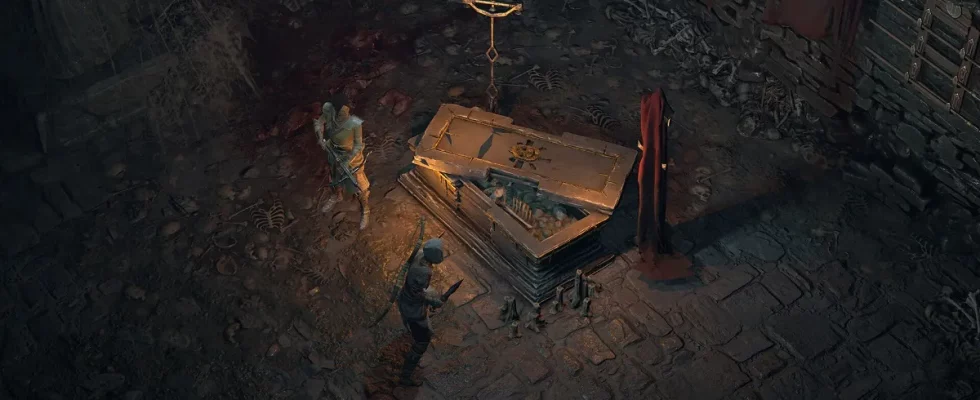 Diablo 4: two players look at a half-open coffin.